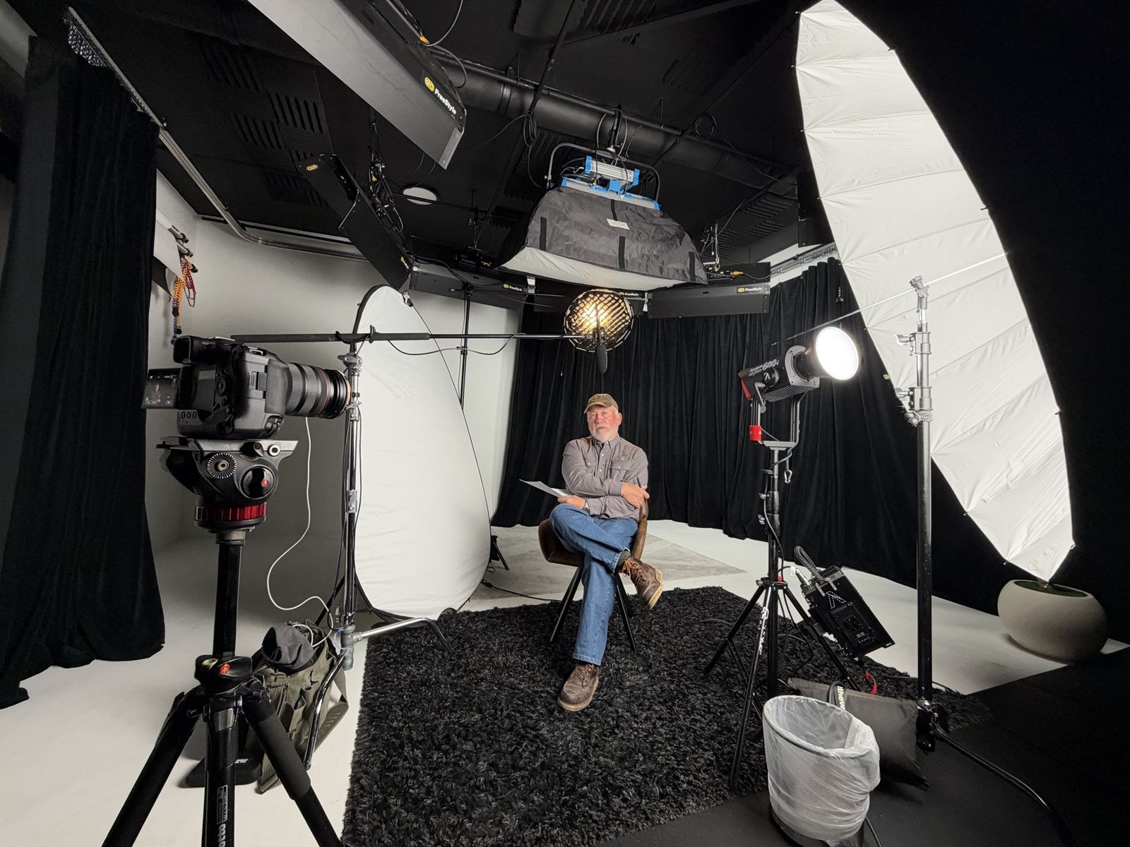 An interview being filmed in a studio during a Spade content shoot